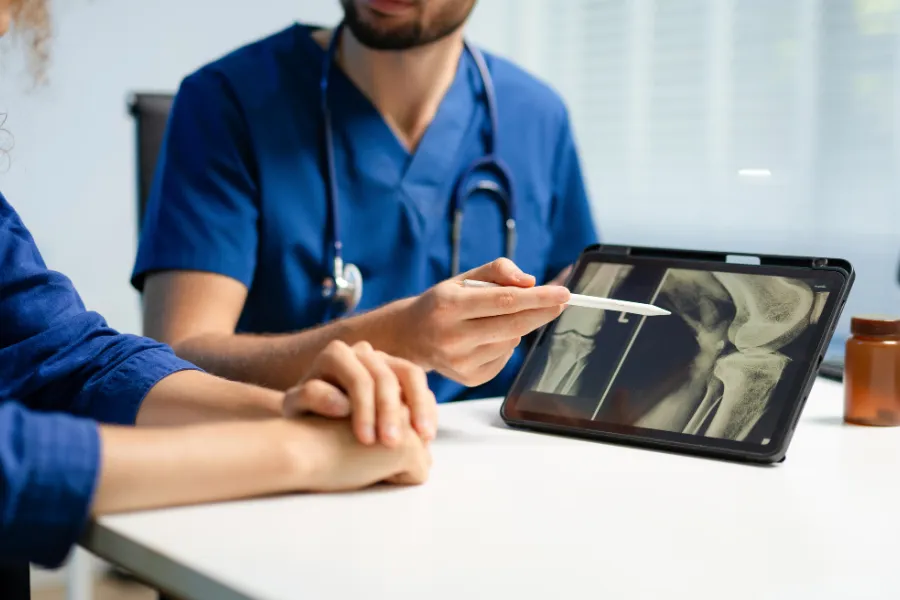 Doctor pointing to tablet