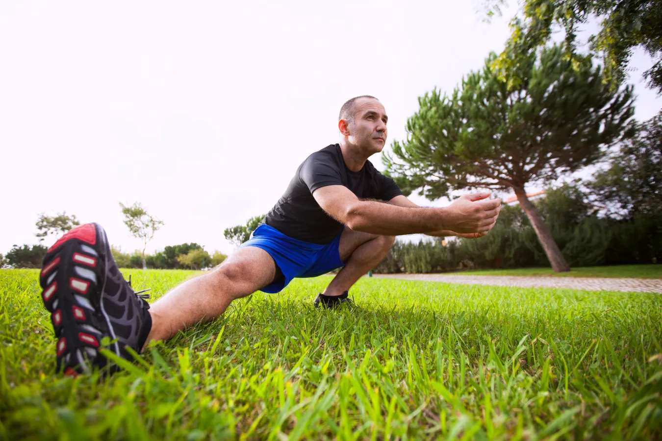 person practicing gentle knee and leg movements at home