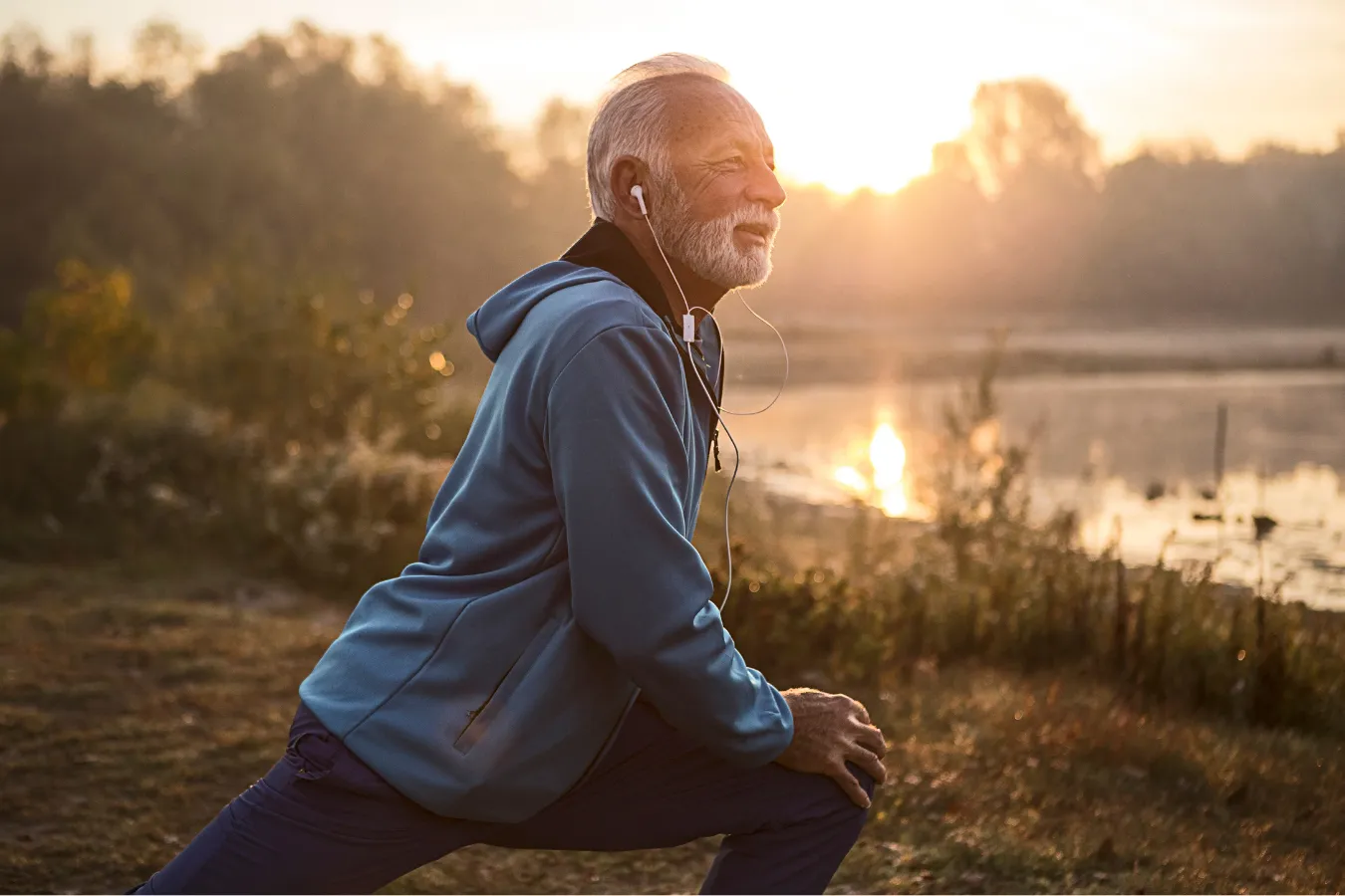 Older man stretching comfortably after successful LDRT treatment for chronic joint pain
