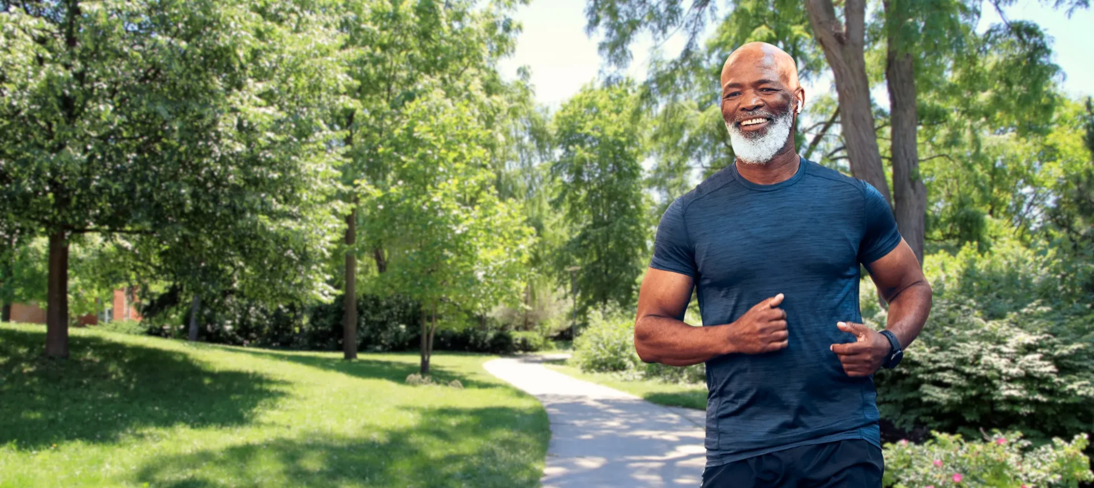 Man jogging on a outdoor sunny path